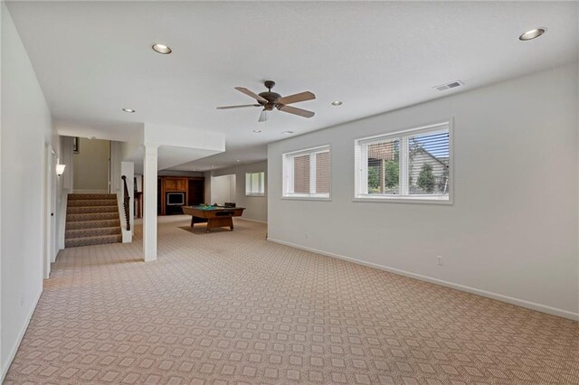 5716 W 146th St, Overland Park, KS 66223 - unfurnished living room featuring pool table, light colored carpet, stairs, recessed lighting, and a ceiling fan