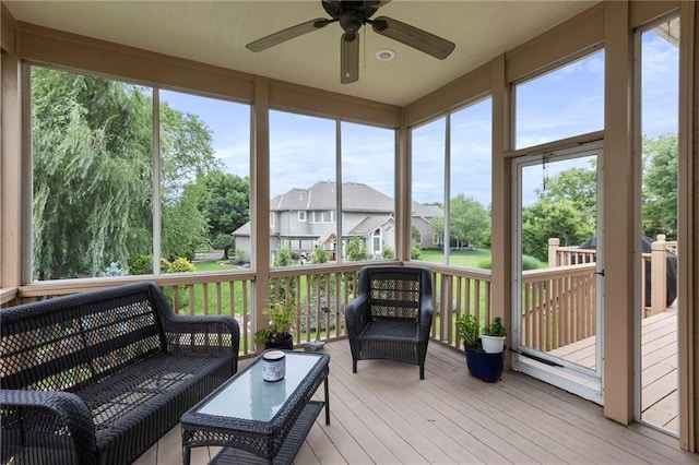 5716 W 146th St, Overland Park, KS 66223 - sunroom / solarium featuring a ceiling fan, a residential view, and an outdoor hangout area