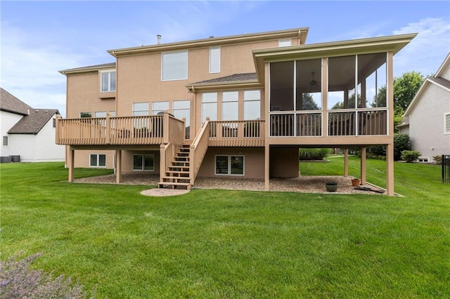 5716 W 146th St, Overland Park, KS 66223 - rear view of house with a sunroom, a wooden deck, stairs, stucco siding, and a yard