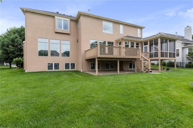 5716 W 146th St, Overland Park, KS 66223 - back of house featuring a sunroom, stairway, a lawn, and stucco siding