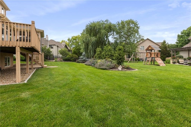 5716 W 146th St, Overland Park, KS 66223 - view of grassy yard featuring a deck and a playground