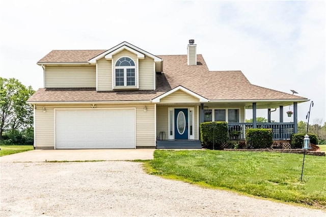 198 SE 455th Rd, Warrensburg, MO 64093 - view of front of home with driveway, a front lawn, covered porch, a chimney, and a garage
