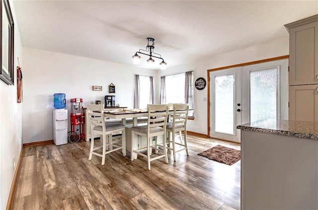198 SE 455th Rd, Warrensburg, MO 64093 - dining area with light wood finished floors and french doors