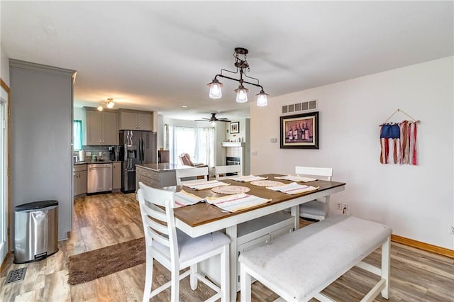 198 SE 455th Rd, Warrensburg, MO 64093 - dining area with light wood finished floors and a ceiling fan