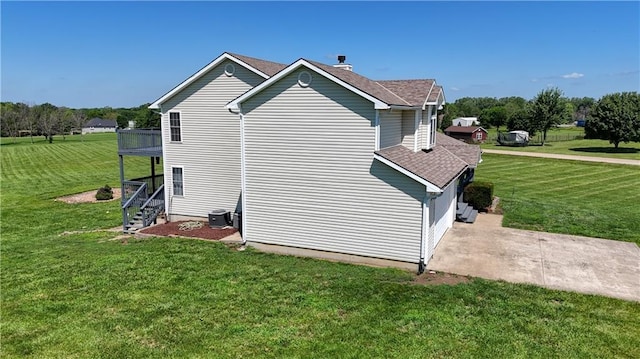 198 SE 455th Rd, Warrensburg, MO 64093 - view of property exterior with a lawn and roof with shingles