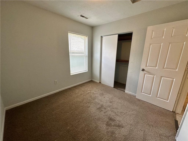 2804 Wenzel Ave, Kansas City, MO 64128 - unfurnished bedroom featuring carpet and a closet
