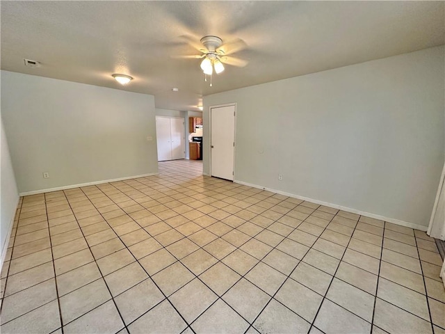 2804 Wenzel Ave, Kansas City, MO 64128 - unfurnished room with ceiling fan and light tile patterned floors