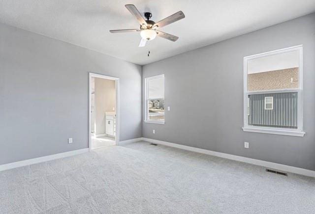 12508 S Parkwood Ln, Lees Summit, MO 64086 - carpeted spare room with ceiling fan and baseboards