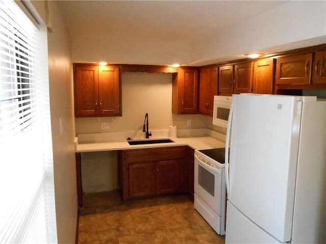 1019 N Kiger Rd, Independence, MO 64050 - kitchen with white appliances, brown cabinets, and light countertops