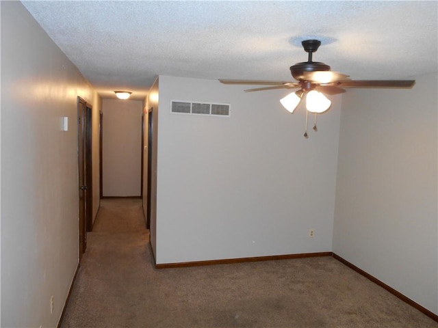 1019 N Kiger Rd, Independence, MO 64050 - spare room featuring a ceiling fan, light colored carpet, and a textured ceiling