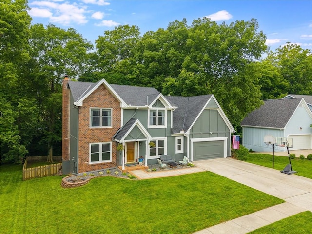 617 Butternut Ln, Liberty, MO 64068 - view of front of property featuring concrete driveway, a chimney, brick siding, and board and batten siding