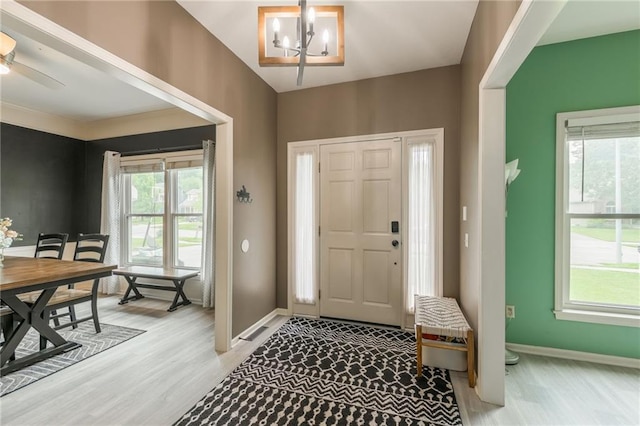 617 Butternut Ln, Liberty, MO 64068 - entrance foyer featuring a chandelier and light wood finished floors