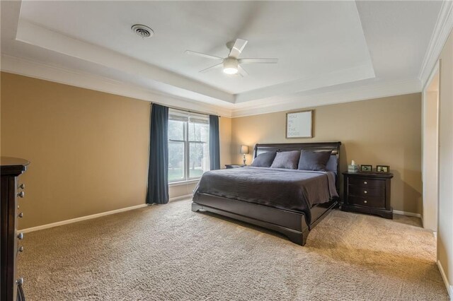 617 Butternut Ln, Liberty, MO 64068 - carpeted bedroom with a tray ceiling, ceiling fan, and crown molding