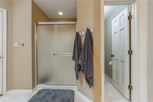 617 Butternut Ln, Liberty, MO 64068 - bathroom featuring a stall shower and tile patterned floors