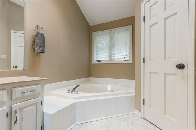 617 Butternut Ln, Liberty, MO 64068 - full bath with a garden tub, vanity, lofted ceiling, and tile patterned floors