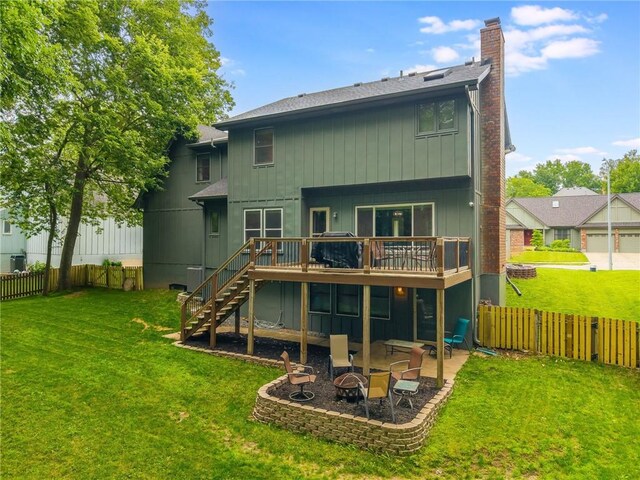 617 Butternut Ln, Liberty, MO 64068 - rear view of house with an outdoor fire pit, stairs, a wooden deck, a chimney, and a fenced backyard