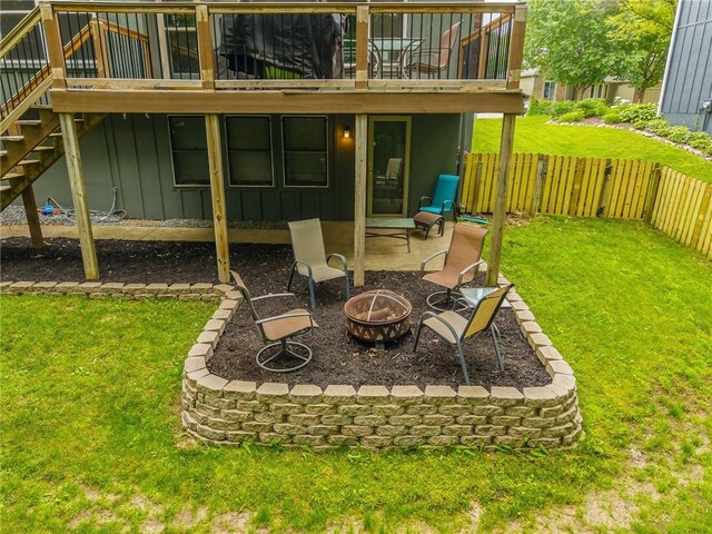 617 Butternut Ln, Liberty, MO 64068 - view of yard with a fire pit, stairs, a patio, and a wooden deck
