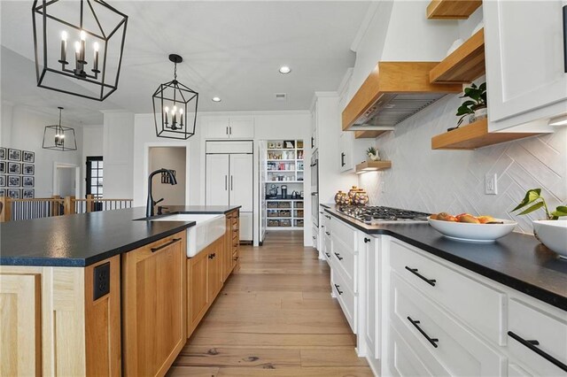 17316 Noland St, Overland Park, KS 66221 - kitchen with custom exhaust hood, open shelves, paneled built in refrigerator, dark countertops, and recessed lighting