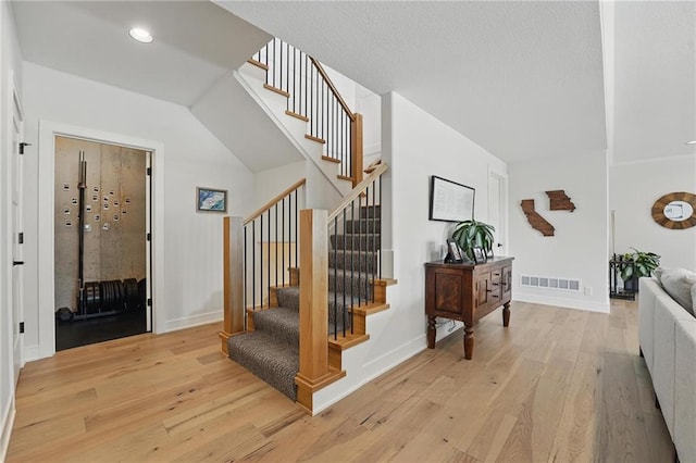 17316 Noland St, Overland Park, KS 66221 - stairs with hardwood / wood-style floors and recessed lighting