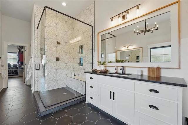 17316 Noland St, Overland Park, KS 66221 - bathroom with healthy amount of natural light, a shower stall, vanity, and a high ceiling
