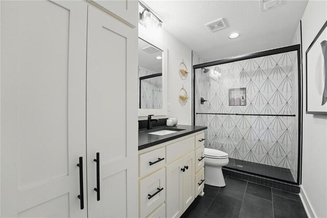 17316 Noland St, Overland Park, KS 66221 - bathroom featuring vanity, a shower stall, and tile patterned floors
