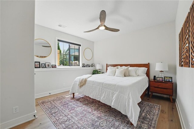 17316 Noland St, Overland Park, KS 66221 - bedroom with wood finished floors and a ceiling fan