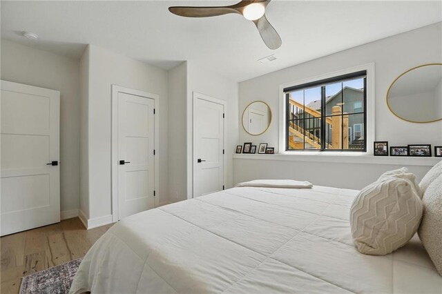 17316 Noland St, Overland Park, KS 66221 - bedroom with wood finished floors and a ceiling fan