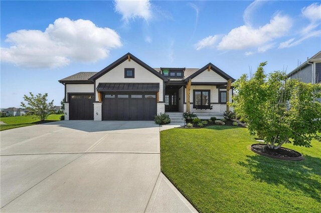 17316 Noland St, Overland Park, KS 66221 - view of front of house with a garage, concrete driveway, a standing seam roof, a front yard, and a metal roof