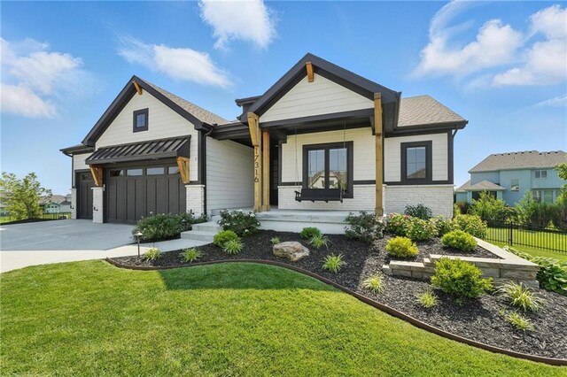 17316 Noland St, Overland Park, KS 66221 - modern inspired farmhouse featuring brick siding, driveway, a porch, and an attached garage