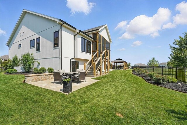 17316 Noland St, Overland Park, KS 66221 - back of house with a fenced backyard, a patio, stairs, a sunroom, and a gazebo