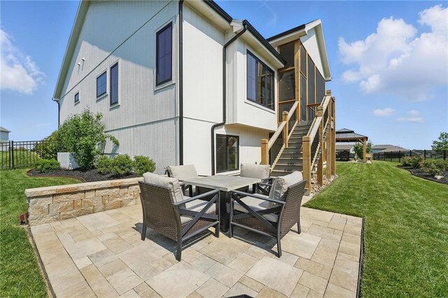 17316 Noland St, Overland Park, KS 66221 - view of patio featuring outdoor dining space and stairs