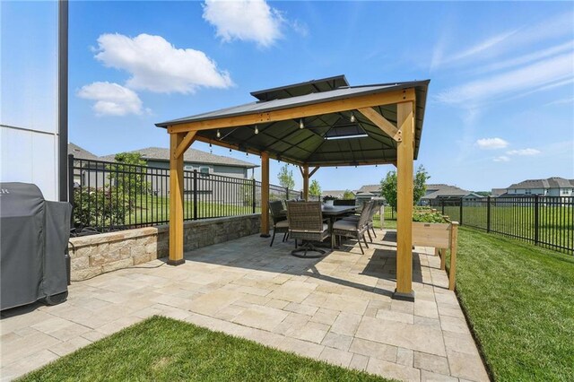 17316 Noland St, Overland Park, KS 66221 - fenced backyard featuring a gazebo, grilling area, a patio, and outdoor dining space
