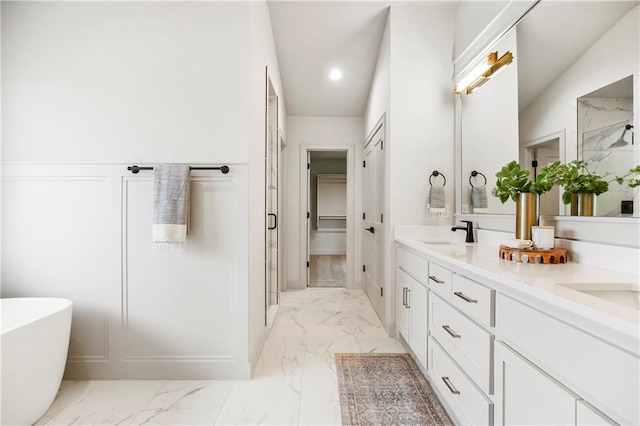 12400 W 184th St, Overland Park, KS 66013 - bathroom featuring marble finish flooring, double vanity, a stall shower, a freestanding tub, and recessed lighting