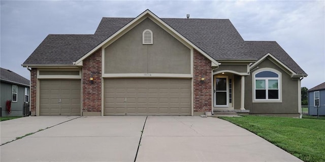 15714 Richmond Ave, Belton, MO 64012 - view of front of house featuring a garage, concrete driveway, a front yard, a shingled roof, and stucco siding