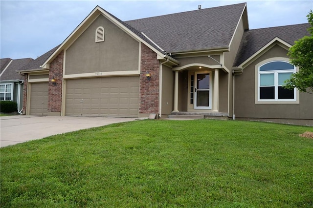 15714 Richmond Ave, Belton, MO 64012 - view of front of home featuring a garage, concrete driveway, a front yard, a shingled roof, and stucco siding