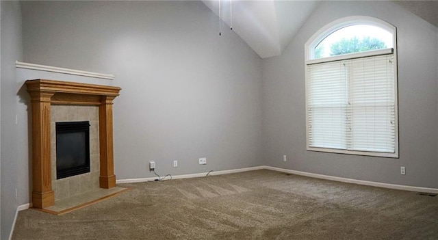 15714 Richmond Ave, Belton, MO 64012 - unfurnished living room with carpet flooring, lofted ceiling, and a fireplace