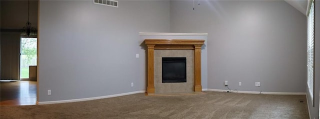 15714 Richmond Ave, Belton, MO 64012 - unfurnished living room featuring carpet flooring and a fireplace