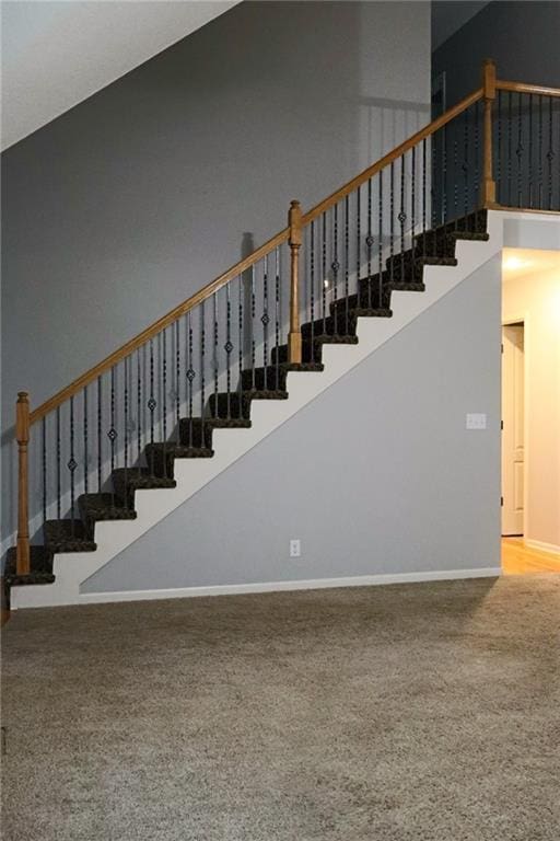 15714 Richmond Ave, Belton, MO 64012 - stairs with a towering ceiling and carpet flooring