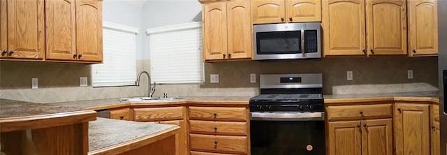 15714 Richmond Ave, Belton, MO 64012 - kitchen featuring appliances with stainless steel finishes, decorative backsplash, and light countertops