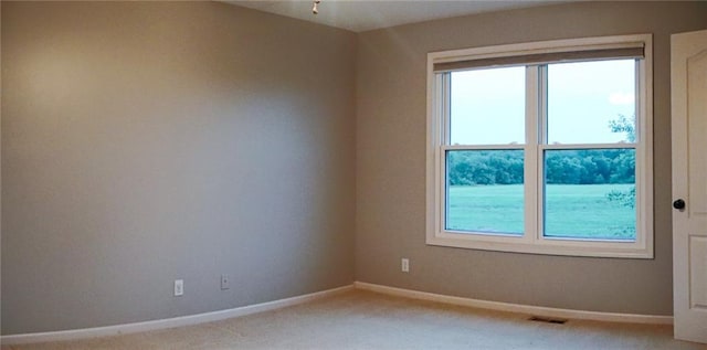 15714 Richmond Ave, Belton, MO 64012 - spare room with light colored carpet and baseboards