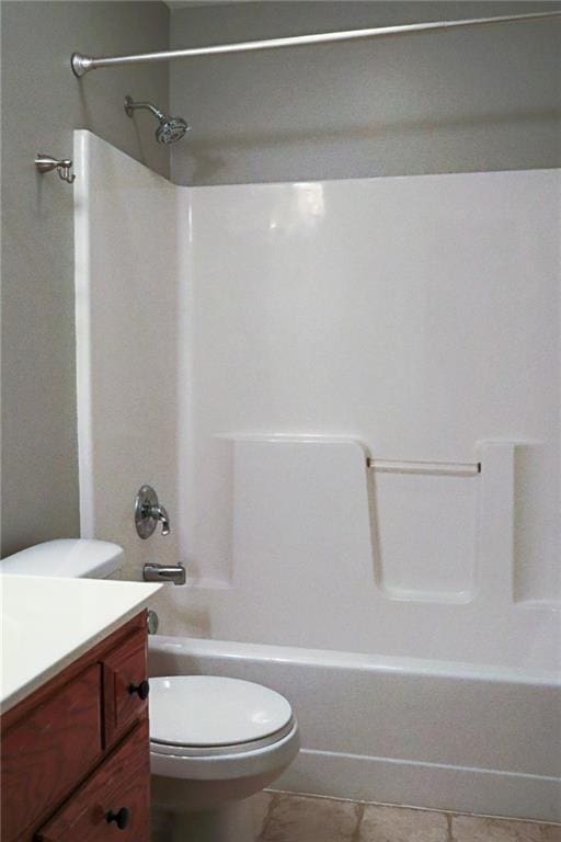 15714 Richmond Ave, Belton, MO 64012 - bathroom featuring vanity, tile patterned floors, and washtub / shower combination