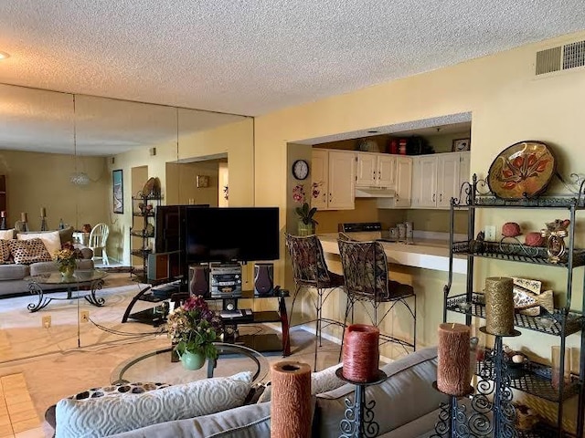 8806 W 106th Ter, Overland Park, KS 66212 - living area featuring a textured ceiling