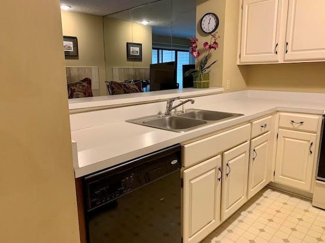 8806 W 106th Ter, Overland Park, KS 66212 - kitchen featuring black dishwasher, light countertops, and white cabinetry