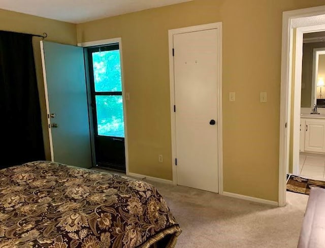 8806 W 106th Ter, Overland Park, KS 66212 - bedroom with light colored carpet and ensuite bathroom