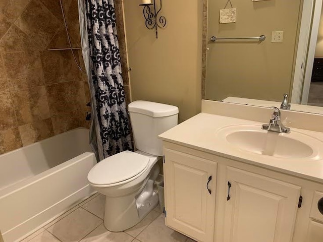 8806 W 106th Ter, Overland Park, KS 66212 - bathroom featuring tile patterned floors, vanity, and shower / bath combo