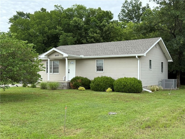 1003 S Ridgeway St, Caney, KS 67333 - single story home featuring a front lawn, covered porch, and roof with shingles
