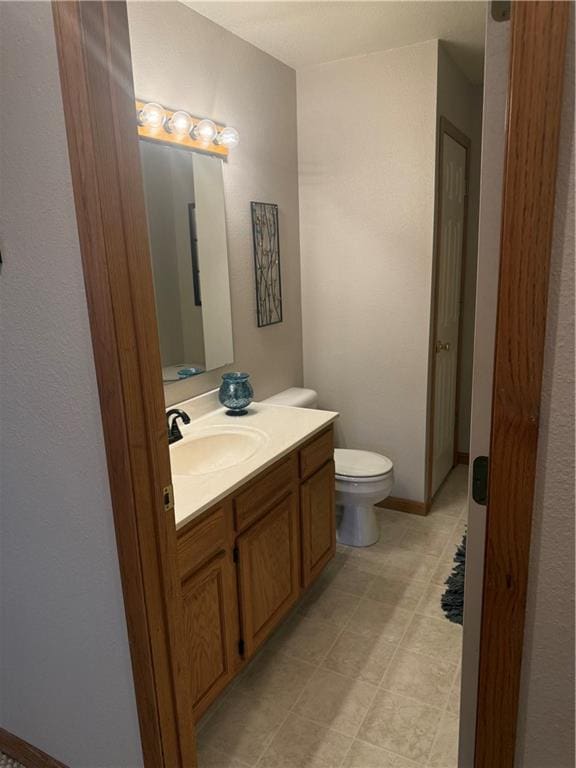 1003 S Ridgeway St, Caney, KS 67333 - bathroom with vanity and toilet