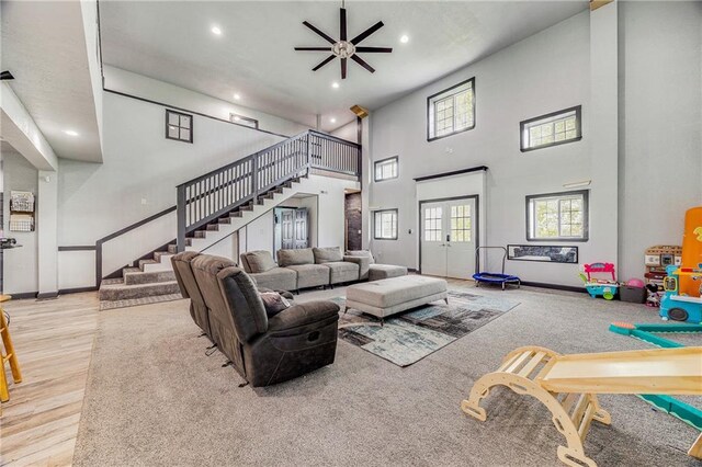 9414 Greenton Rd, Odessa, MO 64076 - living room featuring stairs, recessed lighting, a towering ceiling, healthy amount of natural light, and a ceiling fan