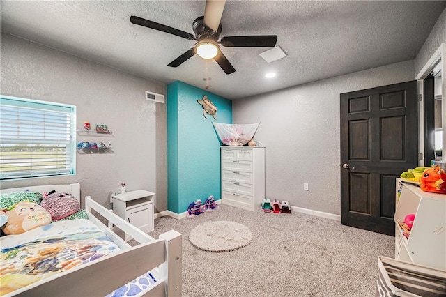 9414 Greenton Rd, Odessa, MO 64076 - bedroom featuring a textured wall, a textured ceiling, carpet flooring, and ceiling fan