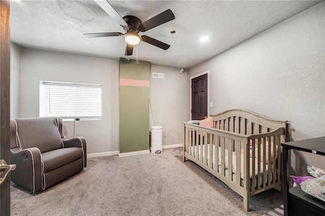 9414 Greenton Rd, Odessa, MO 64076 - carpeted bedroom with a nursery area, a textured ceiling, a ceiling fan, and a textured wall
